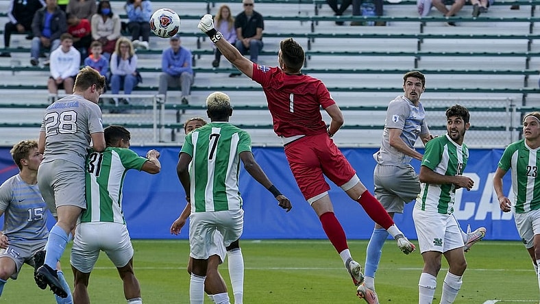 May 14, 2021; Cary, North Carolina, USA; Marshall goalkeeper Oliver Semmle (1) gets a block against North Carolina. Mandatory Credit: Jim Dedmon-USA TODAY Sports