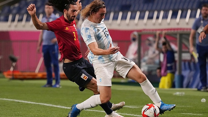 Jul 28, 2021; Saitama, Japan; Team Argentina forward Pedro de la Vega (15) battles for the ball with Team Spain defender Marc Cucurella (3) during the Tokyo 2020 Olympic Summer Games at Saitama Stadium. Mandatory Credit: Jack Gruber-USA TODAY Sports