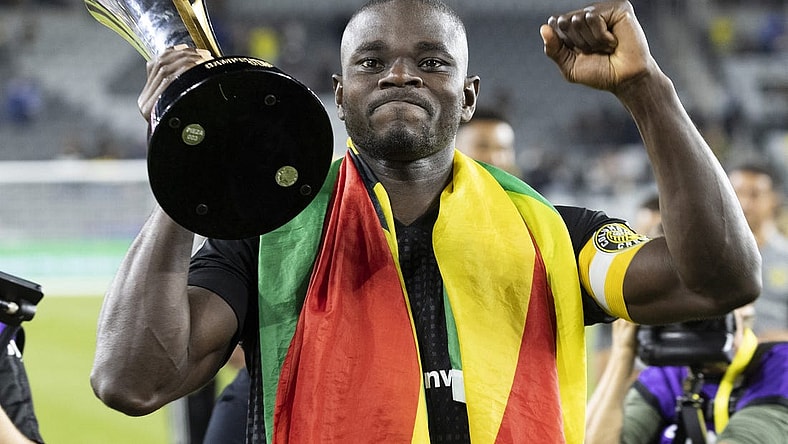 Sep 29, 2021; Columbus, OH, USA; Columbus Crew defender Jonathan Mensah (4) displays the trophy for supporters after defeating Cruz Azul to win the 2021 Campeones Cup match at Lower.com Field Mandatory Credit: Greg Bartram-USA TODAY Sports