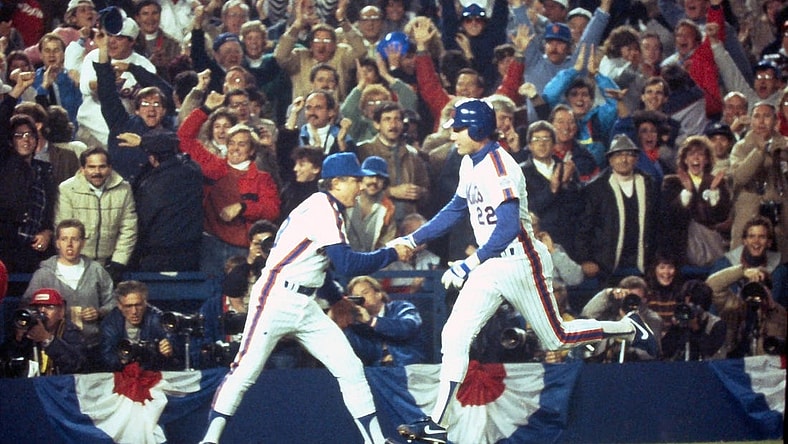 Mets Ray Knight is congratulated by third base coach Bud Harrelson after his 7th inning home run off Boston's Calvin Schiraldi broke a 3-3 tie during Game 7 of the World Series at Shea Stadium Oct. 27, 1986.

Mets Vs Red Sox 1986 World Series