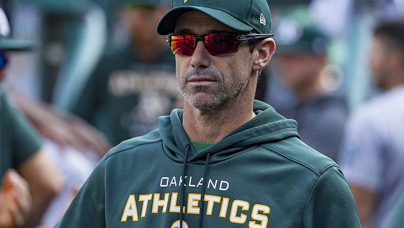 May 10, 2022; Detroit, Michigan, USA; Oakland Athletics bench coach Brad Ausmus (16) looks on from the dugout during the fourth inning against the Detroit Tigers at Comerica Park. Mandatory Credit: Raj Mehta-USA TODAY Sports