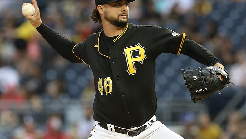 Aug 20, 2022; Pittsburgh, Pennsylvania, USA; Pittsburgh Pirates starting pitcher Tyler Beede (48) delivers a pitch  against the Cincinnati Reds during the first inning at PNC Park. Mandatory Credit: Charles LeClaire-USA TODAY Sports