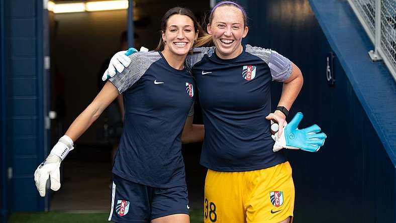 Aug 28, 2022; Kansas City, Kansas, USA; Kansas City Current goalkeeper Sydney Schneider (31) and Kansas City Current goalkeeper Cassie Miller (38) enter the pitch for warm ups before facing the North Carolina Courage at Children's Mercy Park. Mandatory Credit: Amy Kontras-USA TODAY Sports
