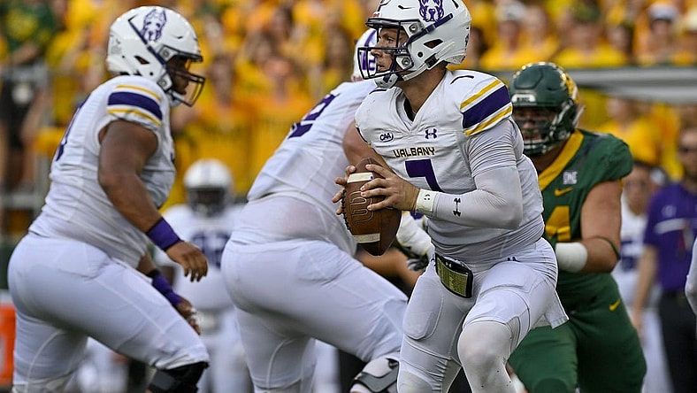 Sep 3, 2022; Waco, Texas, USA; Albany Great Danes quarterback Reese Poffenbarger (7) runs with the ball against the Baylor Bears during the first quarter at McLane Stadium. Mandatory Credit: Jerome Miron-USA TODAY Sports