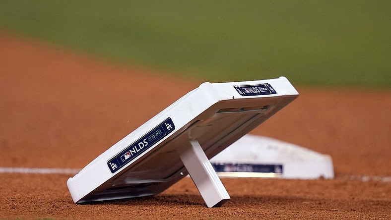 Oct 11, 2022; Los Angeles, California, USA; A detailed view of base with NLDS logo during during game at Dodger Stadium between the Los Angeles Dodgers and the San Diego Padres. Mandatory Credit: Kirby Lee-USA TODAY Sports