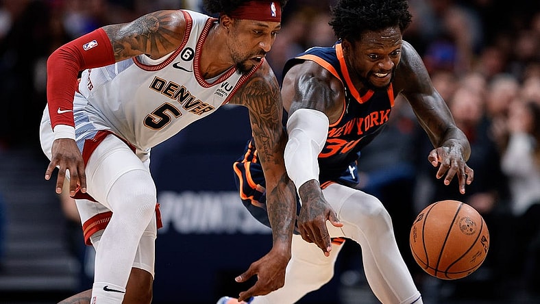 Nov 16, 2022; Denver, Colorado, USA; Denver Nuggets guard Kentavious Caldwell-Pope (5) and New York Knicks forward Julius Randle (30) battle for a loose ball in the fourth quarter at Ball Arena. Mandatory Credit: Isaiah J. Downing-USA TODAY Sports