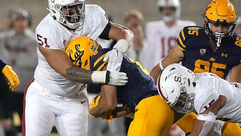 Nov 19, 2022; Berkeley, California, USA; Stanford Cardinal defensive lineman Jaxson Moi (51) tackles California Golden Bears running back Jaydn Ott (6) during the fourth quarter at FTX Field at California Memorial Stadium. Mandatory Credit: Darren Yamashita-USA TODAY Sports
