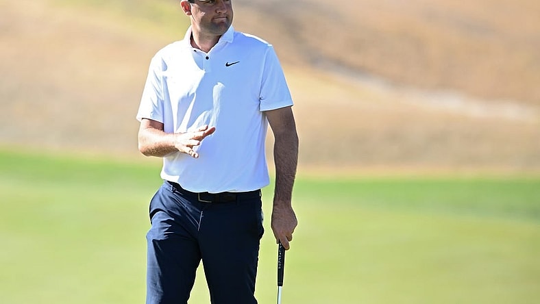 Jan 21, 2023; La Quinta, California, USA; Scottie Scheffler acknowledges the crowd after a putt on the third green during the third round of The American Express golf tournament at Pete Dye Stadium Course. Mandatory Credit: Orlando Ramirez-USA TODAY Sports