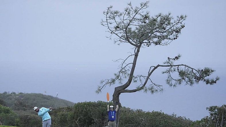 Jan 28, 2023; San Diego, California, USA; Max Homa  plays his shot on the seventeenth hole during the final round of the Farmers Insurance Open golf tournament at Torrey Pines Municipal Golf Course - South Course. Mandatory Credit: Ray Acevedo-USA TODAY Sports