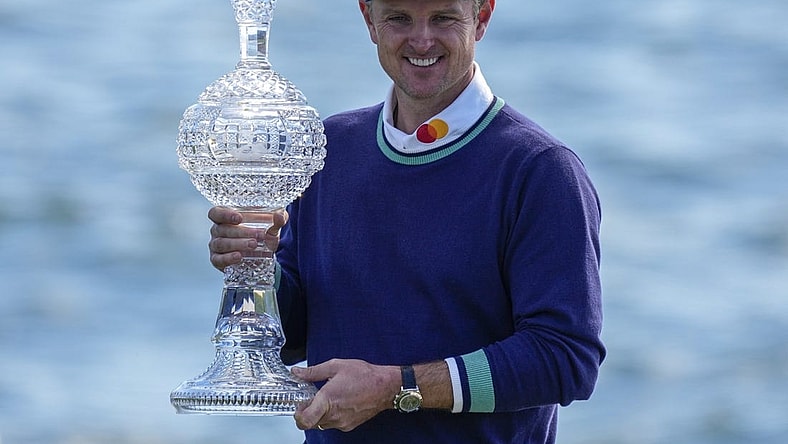 Feb 6, 2023; Pebble Beach, CA, USA; Justin Rose with the championship trophy following the continuation of the final round of the AT&T Pebble Beach Pro-Am golf tournament at Pebble Beach Golf Links. Mandatory Credit: Ray Acevedo-USA TODAY Sports