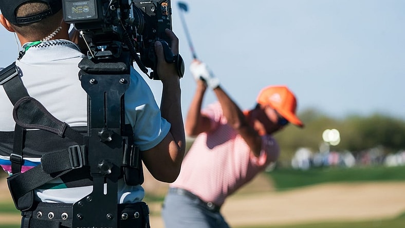 Feb 12, 2023; Scottsdale, Arizona,USA; A general view as the documentary team from Netflix Full Swing works with Rickie Fowler on the range prior to the start of the final round of the WM Phoenix Open golf tournament. Mandatory Credit: Allan Henry-USA TODAY Sports