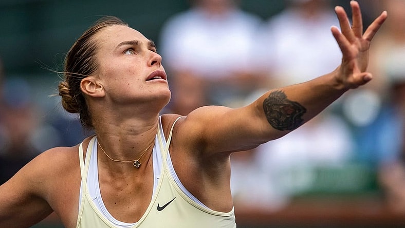 Aryna Sabalenka of Belarus focuses on the ball before taking a swing at Elena Rybakina of Kazakhstan during the women's singles final of the BNP Paribas Open at the Indian Wells Tennis Garden in Indian Wells, Calif., Sunday, March 19, 2023.