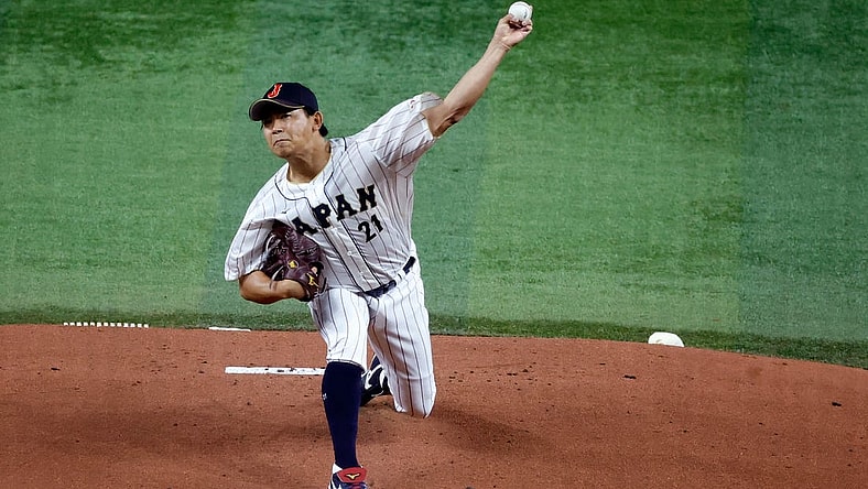 Mar 21, 2023; Miami, Florida, USA; Japan starting pitcher Shota Imanaga (21) pitches against the USA in the first inning at LoanDepot Park. Mandatory Credit: Rhona Wise-USA TODAY Sports