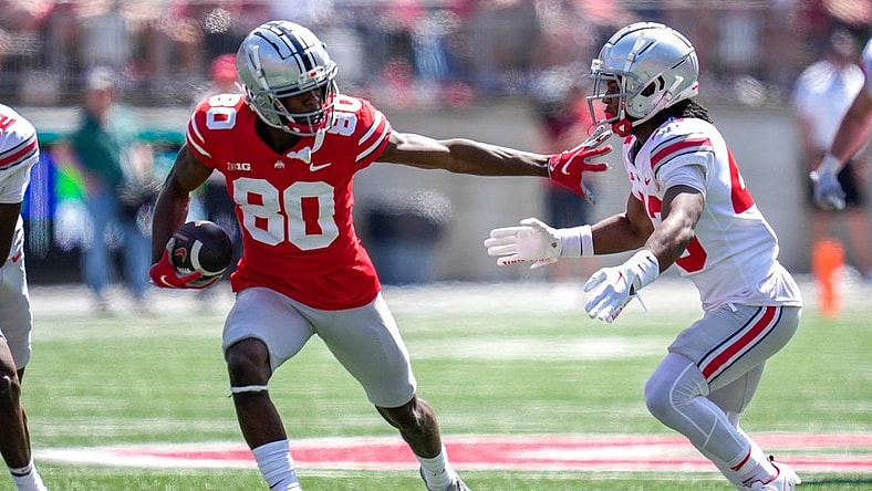 Apr 15, 2023; Columbus, Ohio, United States;  Ohio State Buckeyes wide receiver Noah Rogers (80) evades Ohio State Buckeyes cornerback Diante Griffin (43) during the fourth quarter of the Ohio State Buckeyes spring game at Ohio Stadium on Saturday morning. Mandatory Credit: Joseph Scheller-The Columbus Dispatch

Football Ceb Osufb Spring Game Ohio State At Ohio State