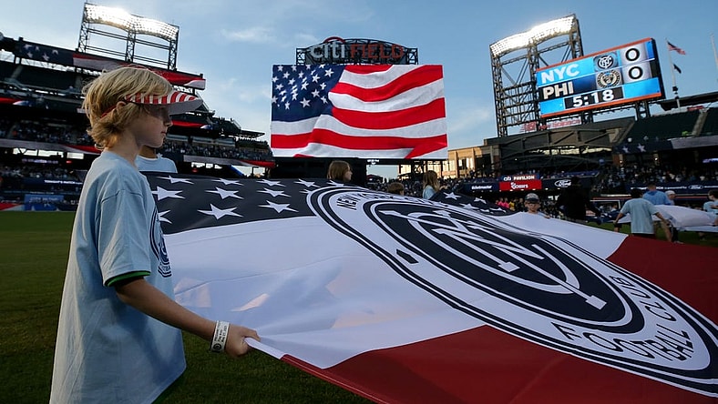 May 27, 2023; Flushing, New York, USA; A young fan holds a banner during the national anthem before a match between New York City FC and the Philadelphia Union at Citi Field. Mandatory Credit: Brad Penner-USA TODAY Sports