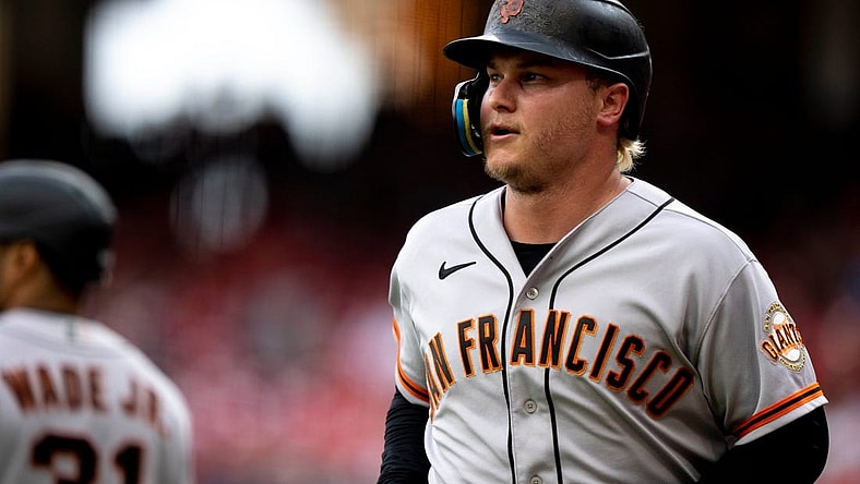 San Francisco Giants designated hitter Joc Pederson (23) smiles after scoring a run in the tenth inning of the MLB baseball game between the Cincinnati Reds and San Francisco Giants at Great American Ball Park in Cincinnati on Tuesday, July 18, 2023. This was during a continuation of yesterdays game which was suspended after a long rain delay.