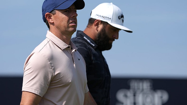 July 20, 2023; Hoylake, England, GBR; Rory McIlroy (left) and Jon Rahm look on during the first round of The Open Championship golf tournament at Royal Liverpool. Mandatory Credit: Kyle Terada-USA TODAY Sports