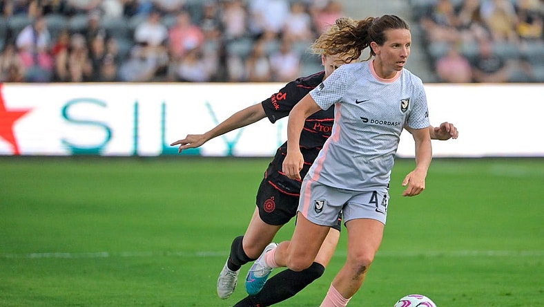 Jul 29, 2023; Los Angeles, CA, USA;  Angel City FC defender Elizabeth Eddy (44) dribbles the ball against Portland Thorns FC defender Natalia Kuikka (14) in the first half at BMO Stadium. Mandatory Credit: Jayne Kamin-Oncea-USA TODAY Sports