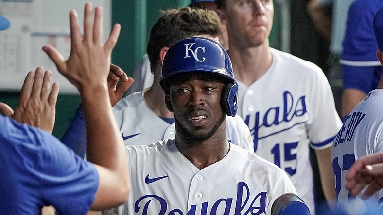 Aug 1, 2023; Kansas City, Missouri, USA; Kansas City Royals second baseman Samad Taylor (0) is congratulated in the dugout against the New York Mets after scoring in the fifth inning at Kauffman Stadium. Mandatory Credit: Denny Medley-USA TODAY Sports