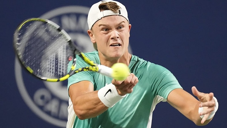 Aug 9, 2023; Toronto, Ontario, Canada; Holger Rune (DEN) hits a ball to Marcos Giron (not pictured) at Sobeys Stadium. Mandatory Credit: John E. Sokolowski-USA TODAY Sports