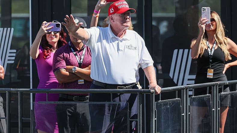 Aug 13, 2023; Bedminster, New Jersey, USA; Former President Donald Trump waves to the fans during the final round of the LIV Golf Bedminster golf tournament at Trump National Bedminster. Mandatory Credit: Vincent Carchietta-USA TODAY Sports