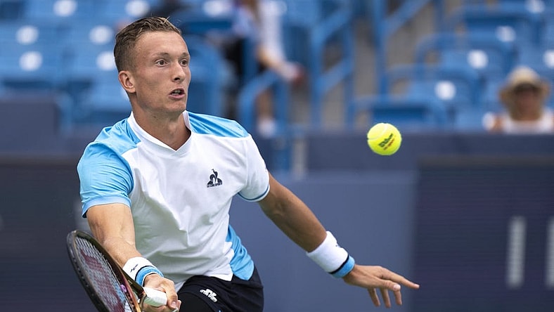 Aug 15, 2023; Mason, OH, USA; Jiri Lehecka, of Czech Republic, hits a return to Taylor Fritz, of the United States, during the Western & Southern Open at Lindner Family Tennis Center. Mandatory Credit: Albert Cesare-USA TODAY Sports