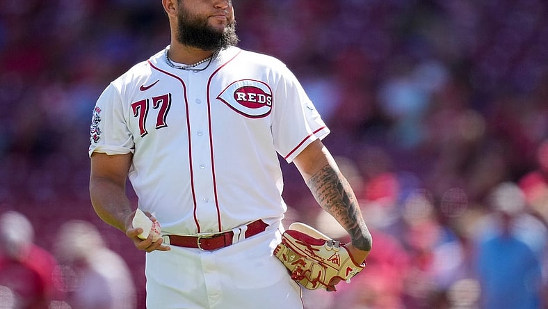 Cincinnati Reds relief pitcher Daniel Duarte (77) tosses a rosin bag and shakes his head after giving up a solo home run to Chicago Cubs right fielder Seiya Suzuki (27) in the eighth inning of an MLB National League game between the Cincinnati Reds and the Chicago Cubs at Great American Ball Park in downtown Cincinnati on Friday, Sept. 1, 2023. The Cubs won the first game of the doubleheader, 6-2.