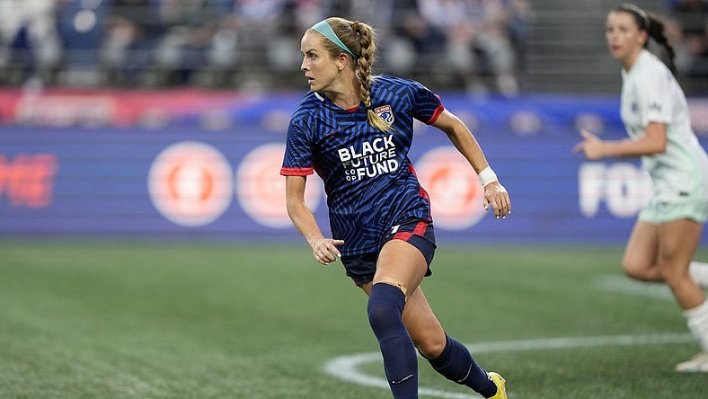 Sep 6, 2023; Seattle, WA, USA; OL Reign midfielder Nikki Stanton (7) kicks the ball against Racing Louisville FC during the first half at Lumen Field. Mandatory Credit: Stephen Brashear-USA TODAY Sports
