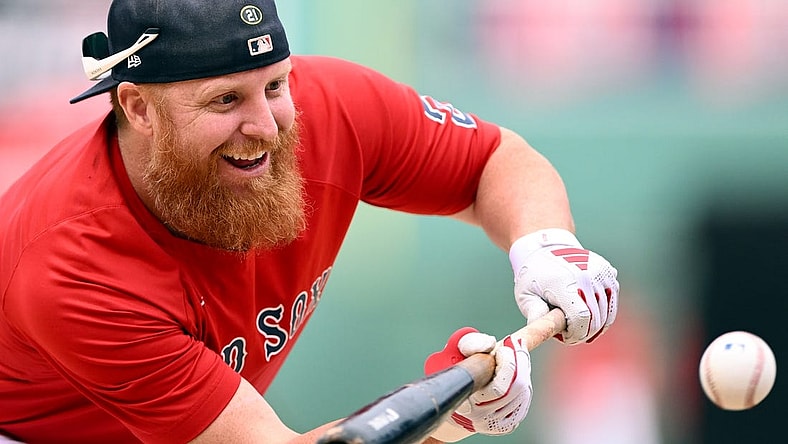 Sep 8, 2023; Boston, Massachusetts, USA; Boston Red Sox designated hitter Justin Turner (2) bunts during batting practice before a game against the Baltimore Orioles at Fenway Park. Mandatory Credit: Brian Fluharty-USA TODAY Sports