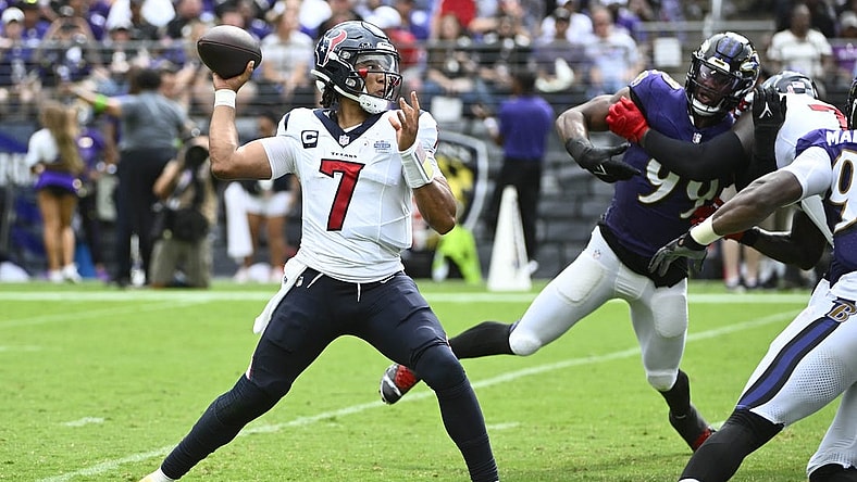 Sep 10, 2023; Baltimore, Maryland, USA; Houston Texans quarterback C.J. Stroud (7) attempts a pass as Baltimore Ravens linebacker Odafe Oweh (99) rushes during the second half at M&T Bank Stadium. Mandatory Credit: Brad Mills-USA TODAY Sports