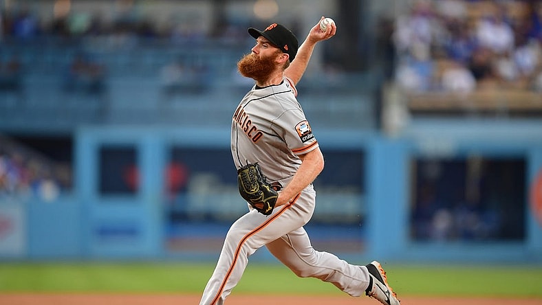 Sep 23, 2023; Los Angeles, California, USA; San Francisco Giants relief pitcher John Brebbia (59) throws against the Los Angeles Dodgers during the first inning at Dodger Stadium. Mandatory Credit: Gary A. Vasquez-USA TODAY Sports