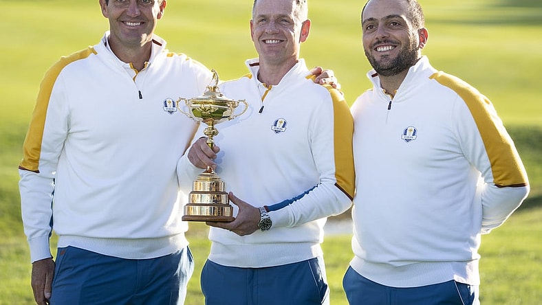 September 26, 2023; Rome, ITALY; (L-R) Team Europe vice-captain Edoardo Molinari, captain Luke Donald, and vice-captain Francesco Molinari pose for a photo with The Ryder Cup trophy during a practice round of the Ryder Cup golf competition at Marco Simone Golf and Country Club. Mandatory Credit: Kyle Terada-USA TODAY Sports