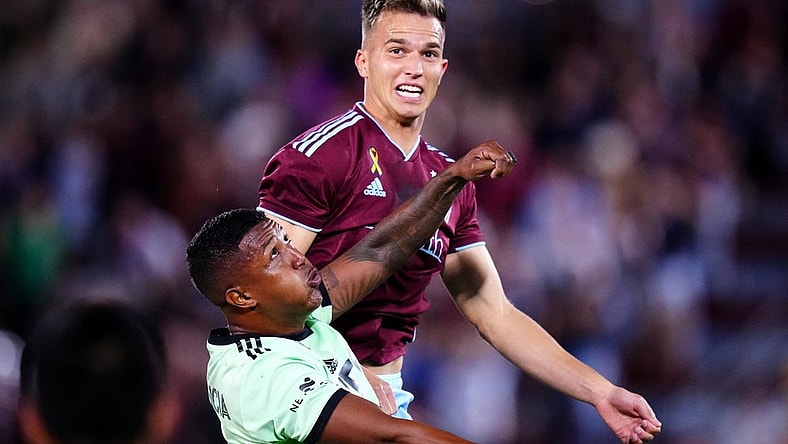 Sep 30, 2023; Commerce City, Colorado, USA; Austin FC midfielder Jhojan Valencia (5) and Colorado Rapids midfielder Cole Bassett (23) during the second half at Dick's Sporting Goods Park. Mandatory Credit: Ron Chenoy-USA TODAY Sports