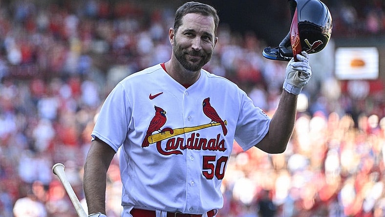 Oct 1, 2023; St. Louis, Missouri, USA;  St. Louis Cardinals pinch hitter Adam Wainwright (50) tips his cap as he receives a standing ovation after his final at bat during the eighth inning against the Cincinnati Reds at Busch Stadium. Mandatory Credit: Jeff Curry-USA TODAY Sports