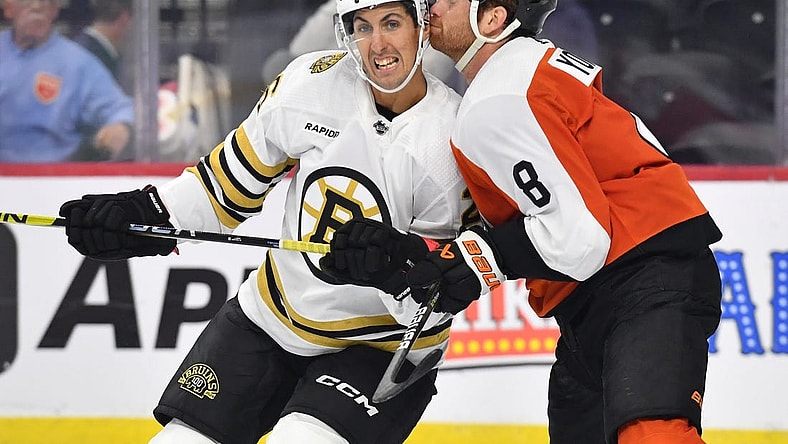 Oct 2, 2023; Philadelphia, Pennsylvania, USA; Boston Bruins center Marc McLaughlin (26) and Philadelphia Flyers defenseman Cam York (8) battle for position during the third period at Wells Fargo Center. Mandatory Credit: Eric Hartline-USA TODAY Sports