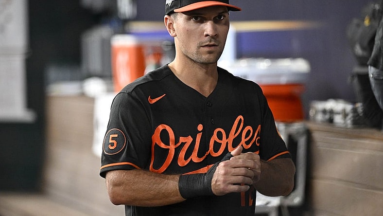 Oct 10, 2023; Arlington, Texas, USA; Baltimore Orioles second baseman Adam Frazier (12) in the dugout during warm ups before game three against the Texas Rangers in the ALDS for the 2023 MLB playoffs at Globe Life Field. Mandatory Credit: Jerome Miron-USA TODAY Sports
