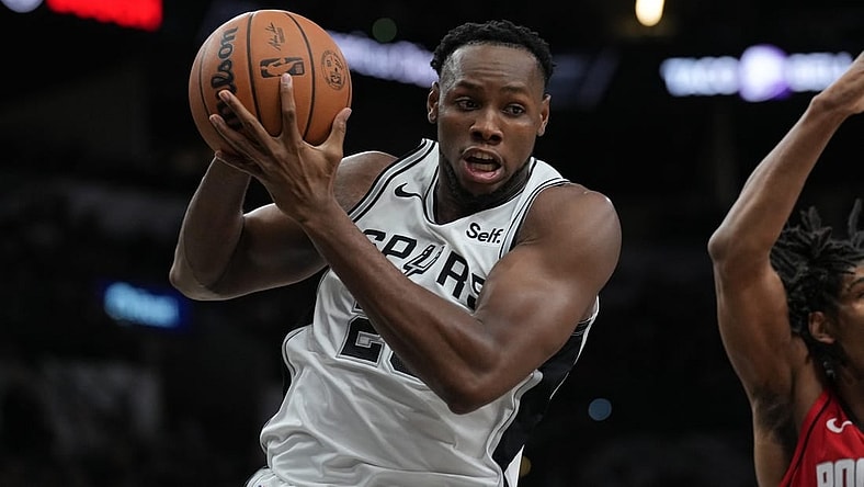 Oct 18, 2023; San Antonio, Texas, USA; San Antonio Spurs center Charles Bassey (28) rebounds in the second half against the Houston Rockets at the Frost Bank Center. Mandatory Credit: Daniel Dunn-USA TODAY Sports