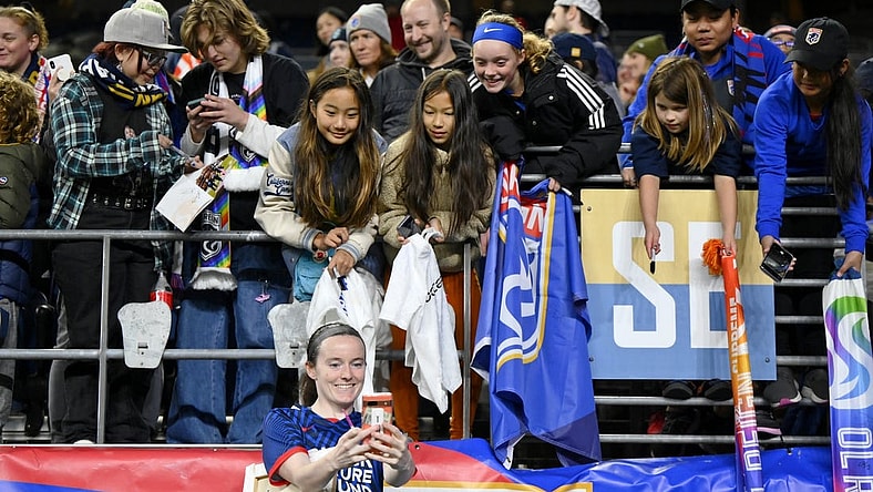 Oct 20, 2023; Seattle, Washington, USA; OL Reign midfielder Rose Lavelle (16) takes a selfie with fans after their win against Angel City FC at Lumen Field. Mandatory Credit: Steven Bisig-USA TODAY Sports