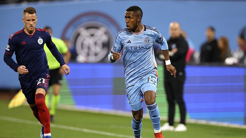 Oct 21, 2023; New York, NY, New York, NY, USA; New York City FC midfielder Andres Perea (15) dribbles against Chicago Fire midfielder Fabian Herbers (21) during the second half at Citi Field. Mandatory Credit: Vincent Carchietta-USA TODAY Sports