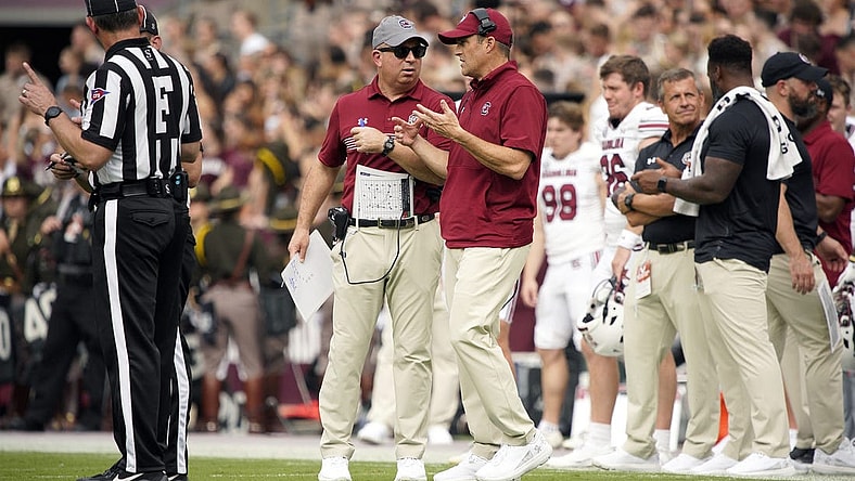 Oct 28, 2023; College Station, Texas, USA; South Carolina Gamecocks head coach Shane Beamer and assistant coach Pete Lembo work the sideline during the second quarter in a game against Texas A&M Aggies at Kyle Field. Mandatory Credit: Dustin Safranek-USA TODAY Sports