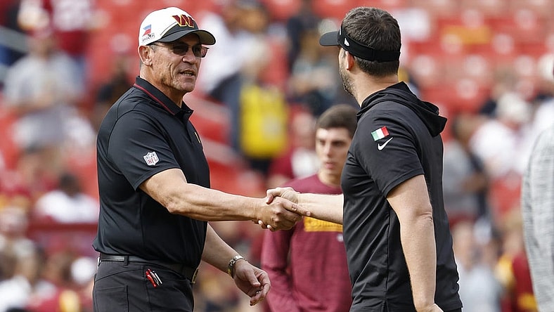 Oct 29, 2023; Landover, Maryland, USA; Washington Commanders head coach Ron Rivera (L) shakes hands with Philadelphia Eagles head coach Nick Sirianni (R) during warmup prior to their game at FedExField. Mandatory Credit: Geoff Burke-USA TODAY Sports
