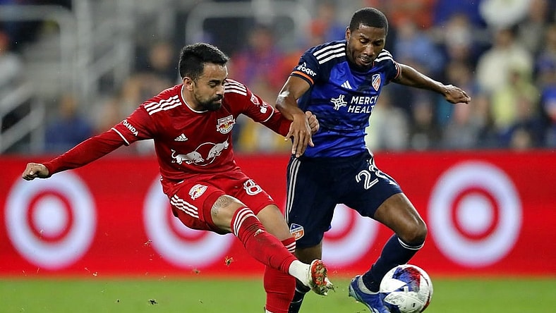 Oct 29, 2023; Cincinnati, OH, USA; New York Red Bulls midfielder Luquinhas (82) battles for the ball against FC Cincinnati defender Ray Gaddis (28) during the first half of game one in a round one match of the 2023 MLS Cup Playoffs at TQL Stadium. Mandatory Credit: Katie Stratman-USA TODAY Sports