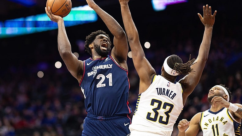 Nov 14, 2023; Philadelphia, Pennsylvania, USA; Philadelphia 76ers center Joel Embiid (21) drives for a shot against Indiana Pacers center Myles Turner (33) during the first quarter at Wells Fargo Center. Mandatory Credit: Bill Streicher-USA TODAY Sports