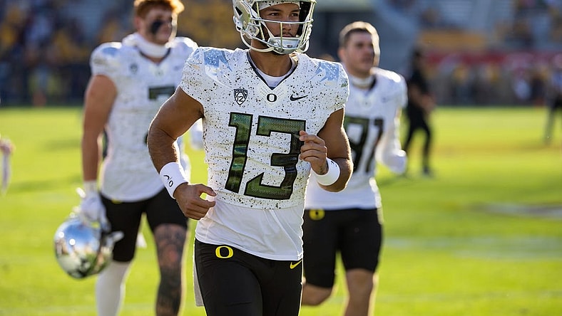 Nov 18, 2023; Tempe, Arizona, USA; Oregon Ducks quarterback Ty Thompson (13) against the Arizona State Sun Devils at Mountain America Stadium. Mandatory Credit: Mark J. Rebilas-USA TODAY Sports