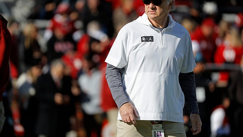 Oklahoma defensive coordinator Ted Roof watches the Sooners warm up before a college football game between the University of Oklahoma Sooners (OU) and the TCU Horned Frogs at Gaylord Family-Oklahoma Memorial Stadium in Norman, Okla., Friday, Nov. 24, 2023. Oklahoma won 69-45.
