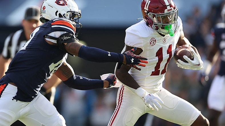Nov 25, 2023; Auburn, Alabama, USA;  Auburn Tigers safety Zion Puckett (10) closes in on Alabama Crimson Tide wide receiver Malik Benson (11) during the first quarter at Jordan-Hare Stadium. Mandatory Credit: John Reed-USA TODAY Sports