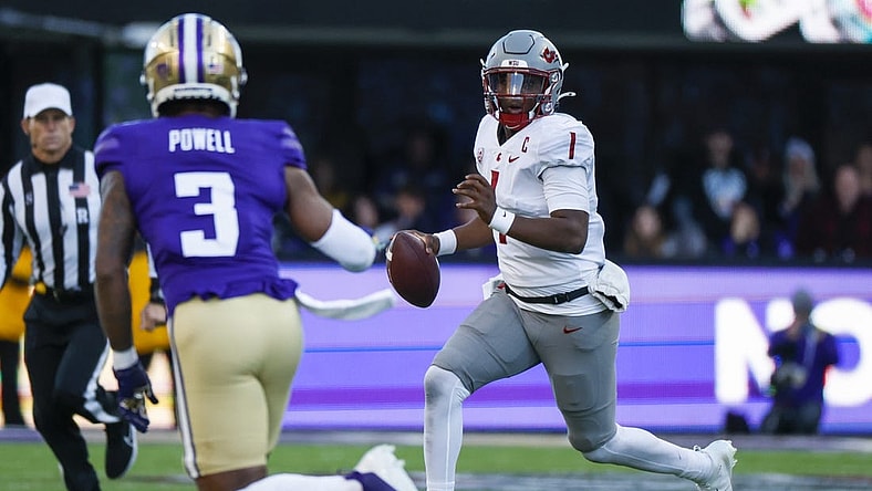 Nov 25, 2023; Seattle, Washington, USA; Washington State Cougars quarterback Cameron Ward (1) scrambles out of the pocket against the Washington Huskies during the second quarter at Alaska Airlines Field at Husky Stadium. Mandatory Credit: Joe Nicholson-USA TODAY Sports
