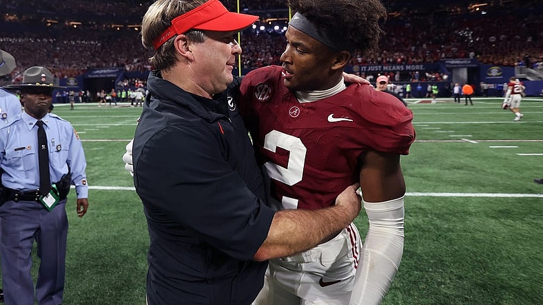 Dec 2, 2023; Atlanta, GA, USA;  Georgia Bulldogs head coach Kirby Smart embraces Alabama Crimson Tide defensive back Caleb Downs (2) after the SEC championship game at Mercedes-Benz Stadium. Mandatory Credit: Brett Davis-USA TODAY Sports