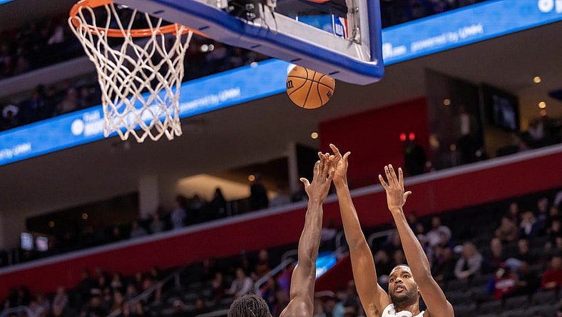 Dec 2, 2023; Detroit, Michigan, USA; Cleveland Cavaliers forward Evan Mobley (4) shoots the ball over Detroit Pistons center Isaiah Stewart (28) during the first half at Little Caesars Arena. Mandatory Credit: David Reginek-USA TODAY Sports