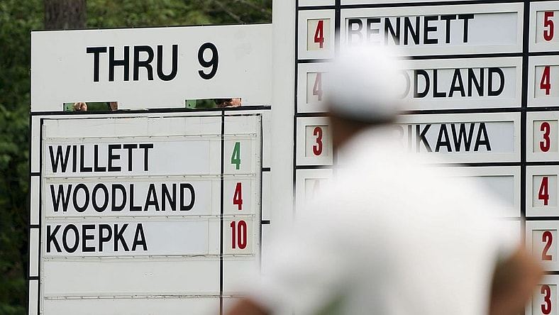 Brooks Koepka checks the scoreboard on no. 10 during the second round of The Masters golf tournament.